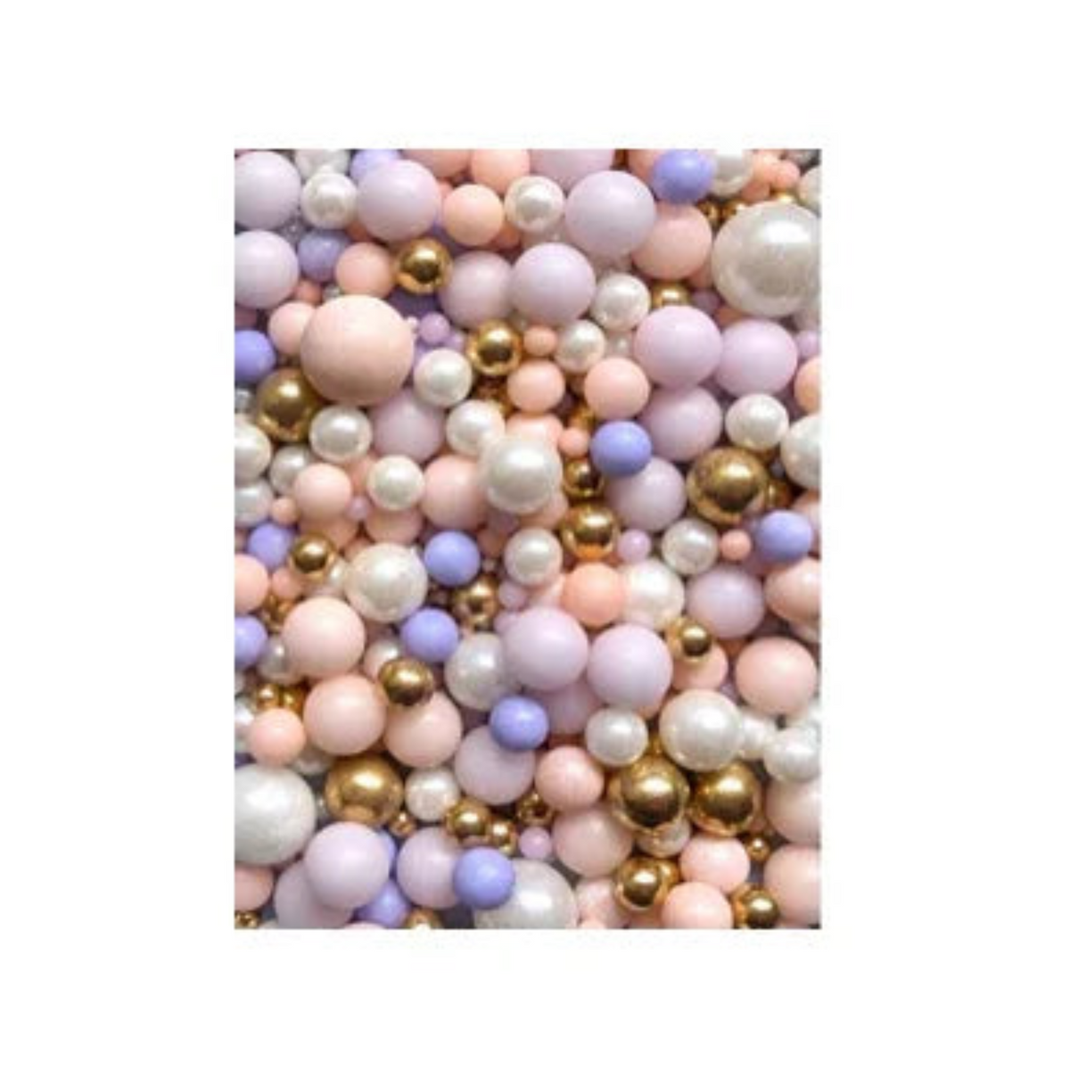 Pete & Will's Nebula edible sugar pearls in pastel pink, purple, white, and gold
